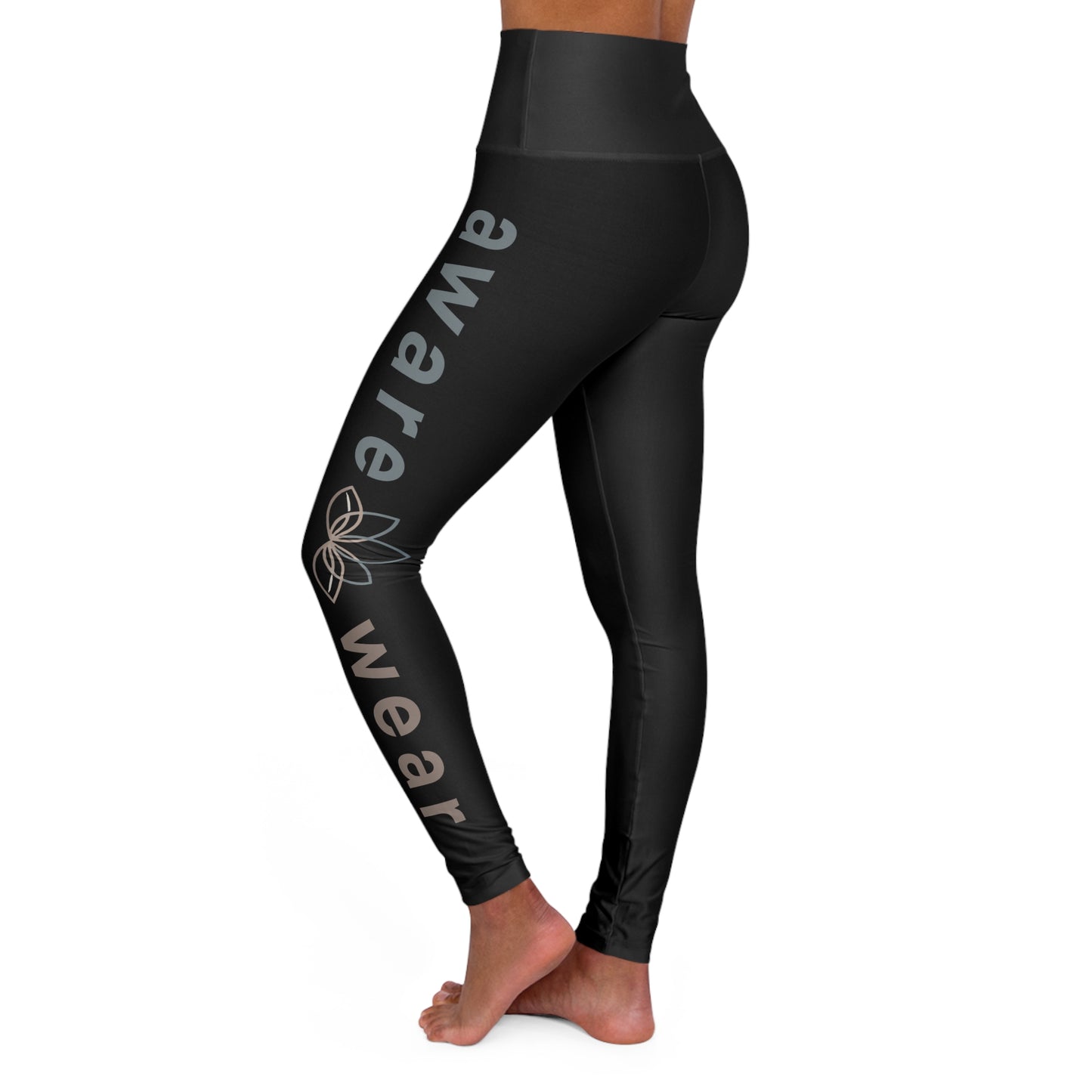 Black leggings with 'aware wear' branding on a white background side view